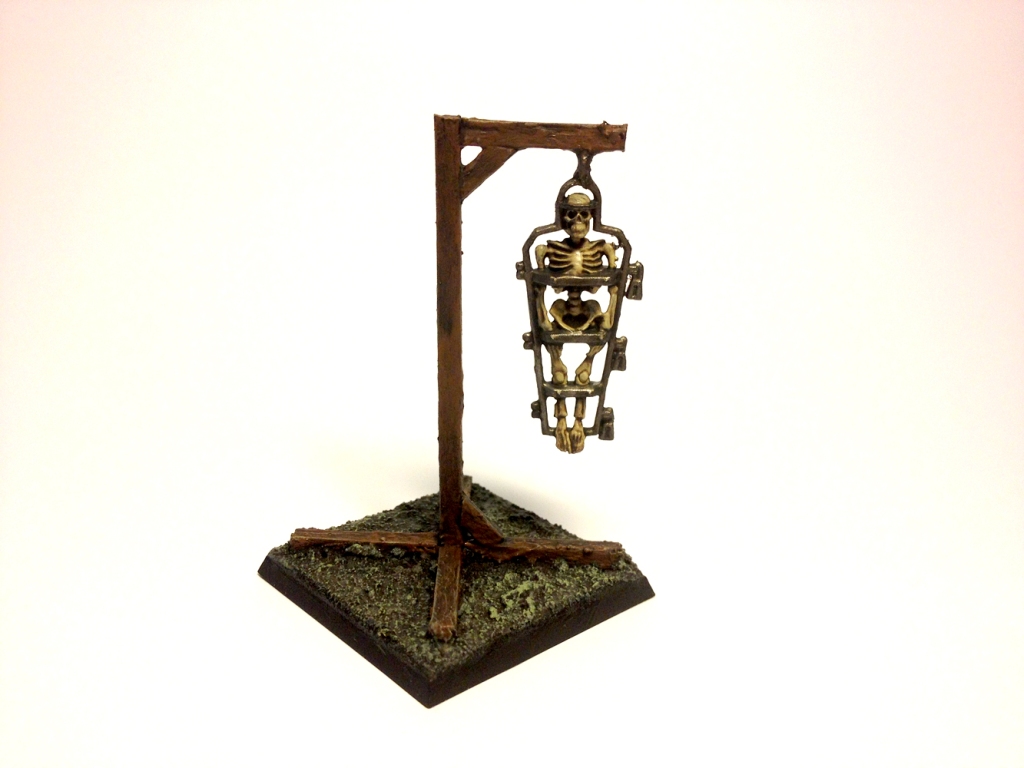 A gibbet, have pity on the poor soul inside.